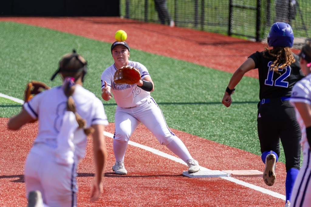 Softball — Errors help, and hurt, Demons in split with&nbsp;Islanders